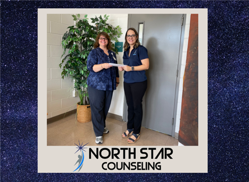  Our director accepting a check from our new business partner, North Star Counseling
